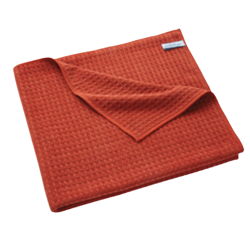 Drap Mozaic H2O at Home en tissu gaufré masaÏ, plié de manière ordonnée